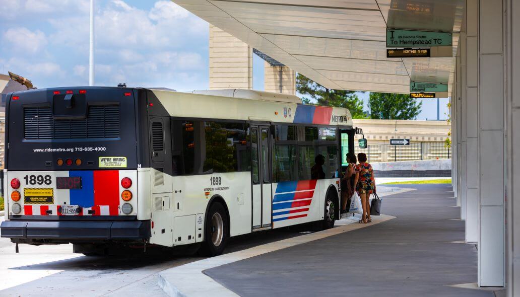 Passengers boarding a METRO bus at Northwest Transit Center.